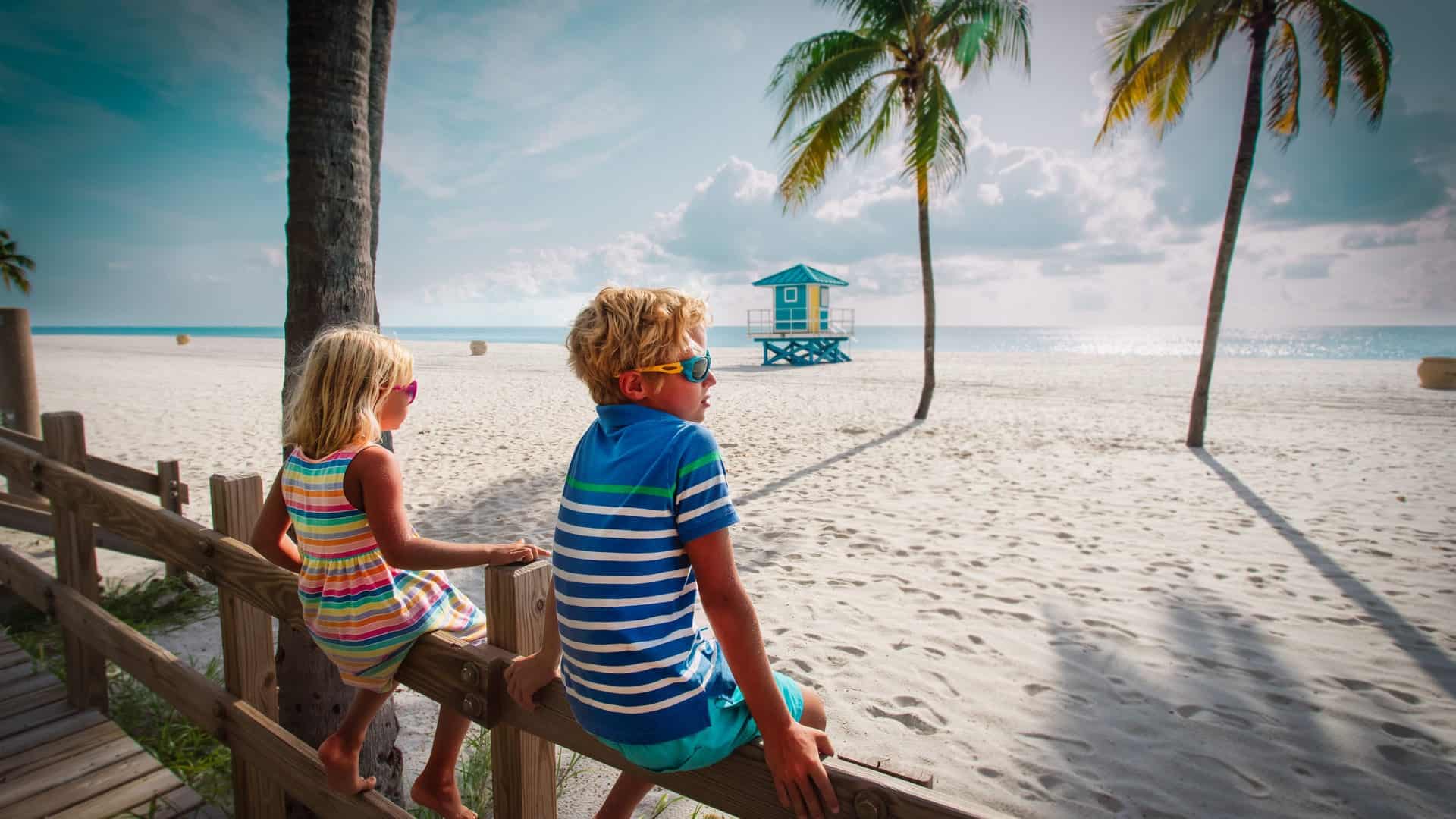 family vacation in florida boy and girl looking at tropical beach