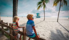 family vacation in florida boy and girl looking at tropical beach