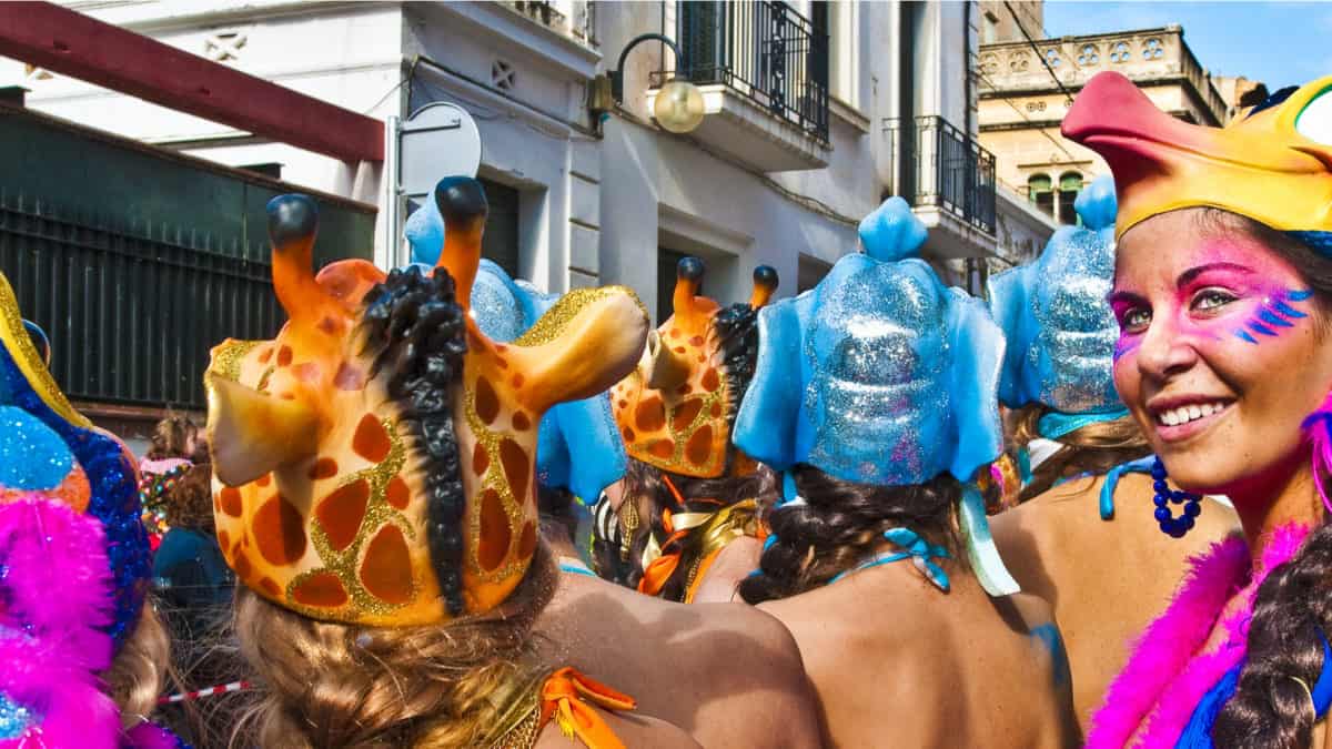 Members of the La Gauche Divine Parade witnesses the Bed Race during Carnival in Sitges Spain
