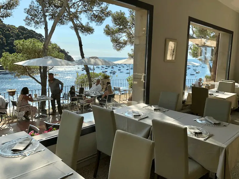 Restaurant view from Hotel Hostalillo in Tamariu on the Costa Brava in Catalunya Spain with Mediterranean Sea in the background
