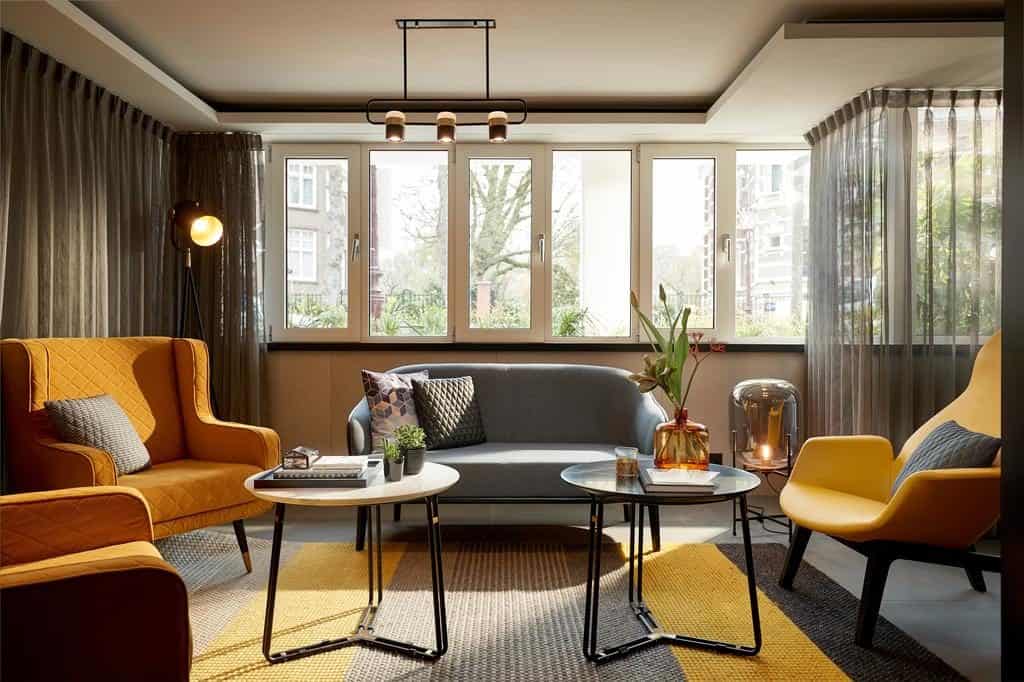 Room view with modern sofa and couches at Park Plaza Hotel Vondelpark Amsterdam Netherlands
