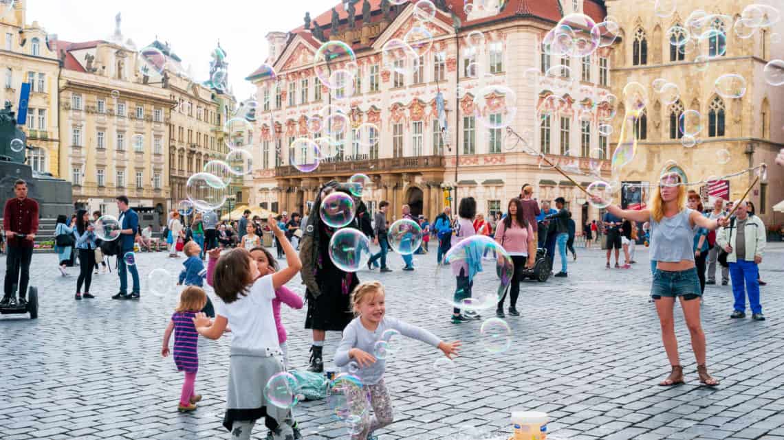 Street artists in Prague Old Town Staromestske Namesti square with bubbles