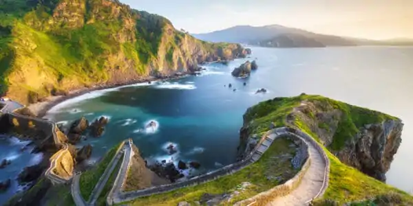 View of the stairs in San Juan de Gaztelugatxe, Basque Country with Atlantic in background