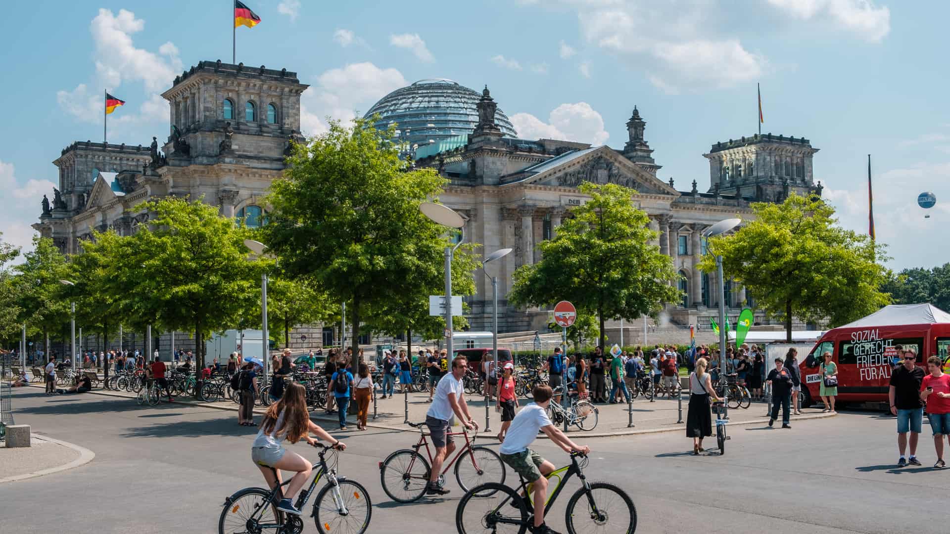 People with bicycles in front of Reichstag, the German parliament, in Berlin, Germany