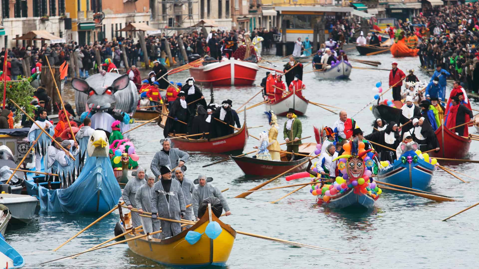 Gondolas in Venice Italy during a colorful family event carnival