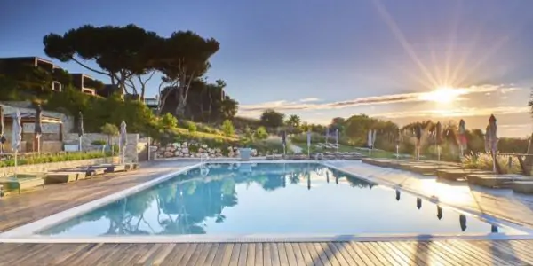 Sunset at pool of Martinhal Sagres Family Beach hotel and resort