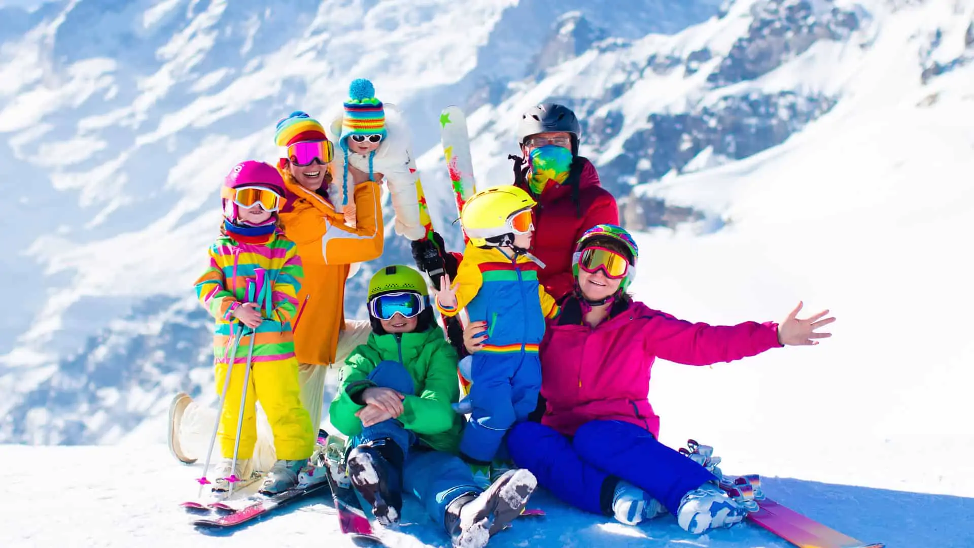 Family skiing in the Swiss Alps in Europe with mountains in the background