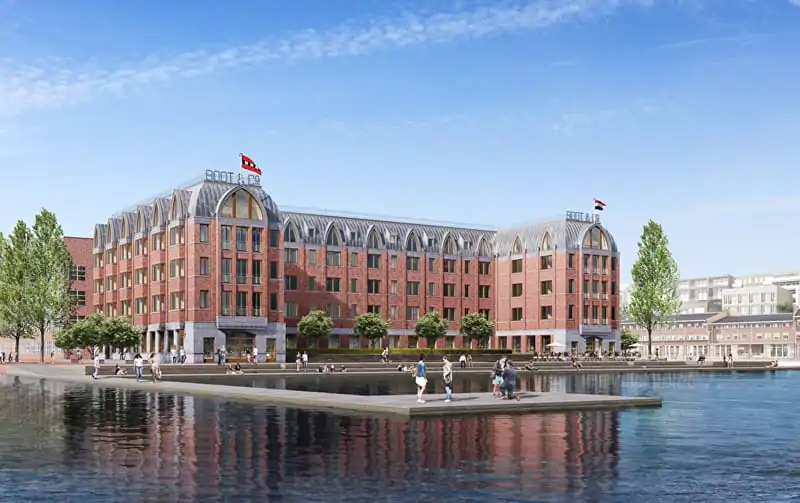 Exterior view of Boat and Co Hotel Amsterdam with water in front of building