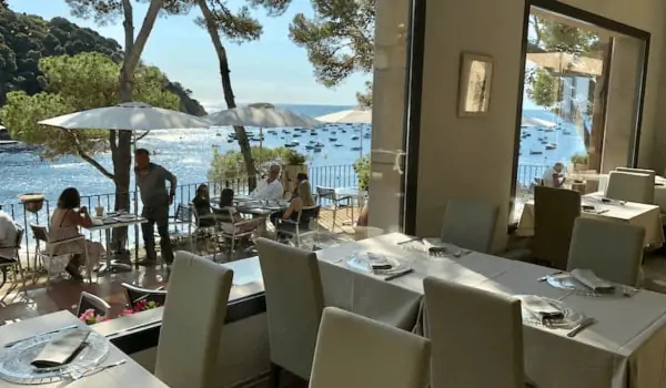 Restaurant view from Hotel Hostalillo in Tamariu on the Costa Brava in Catalunya Spain with Mediterranean Sea in the background