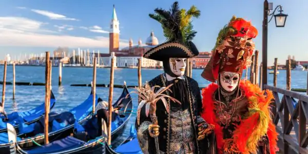 Colorful carnival masks in Venice, Italy with St Mark Basilica in background